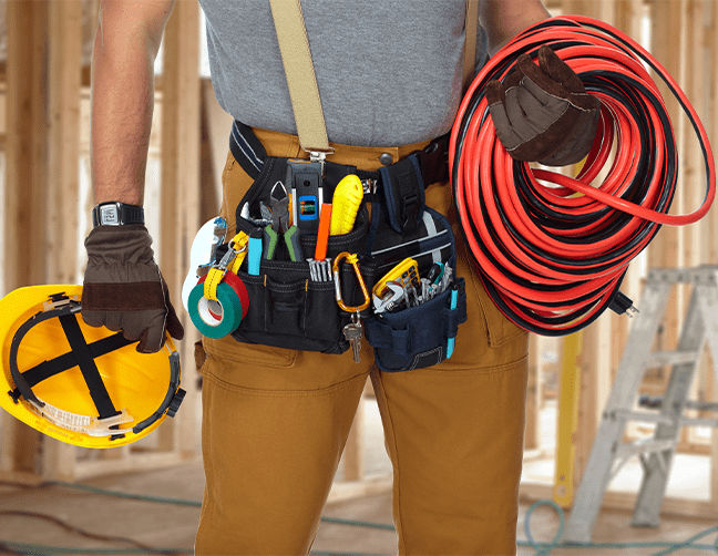 electrical contractor holding gear and equipment